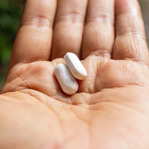 hand holding pills