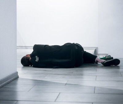 unresponsive man lying on the floor