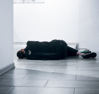 unresponsive man lying on the floor