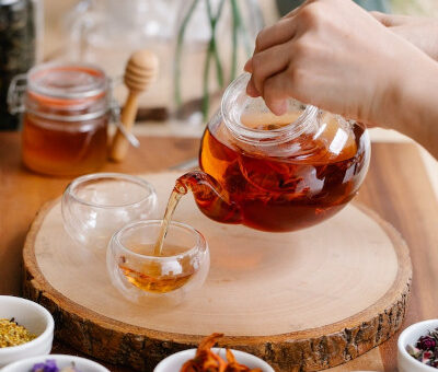 herbal tea in a glass pot, honey