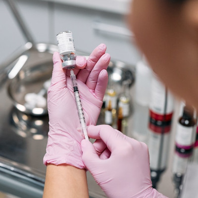 nurse preparing anesthesia, extracting it with a syringe