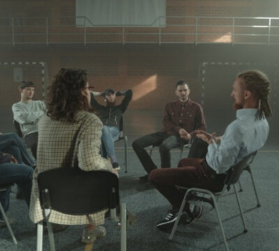 Group counseling, people sitting in a circle, having a conversation