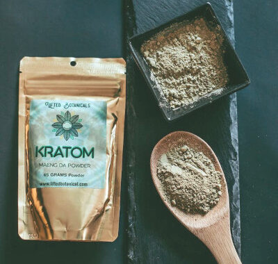 green powder and a bag that says kratom on it