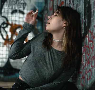 woman feeling high, smoking weed