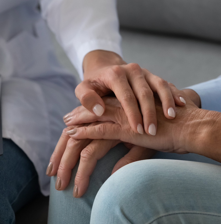 medical nurse, hands touching as a sign of support