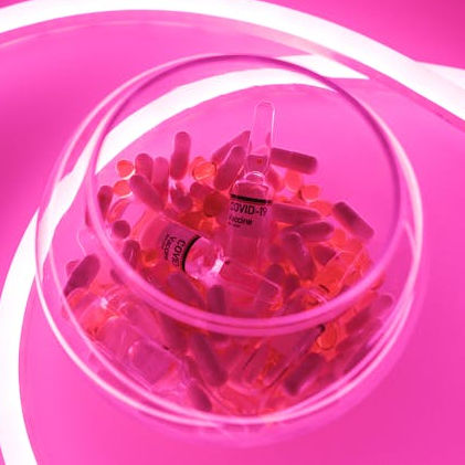 pink pills in a glass bowl