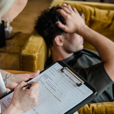 Behavioral Therapy, man sitting on the couch at the doctors