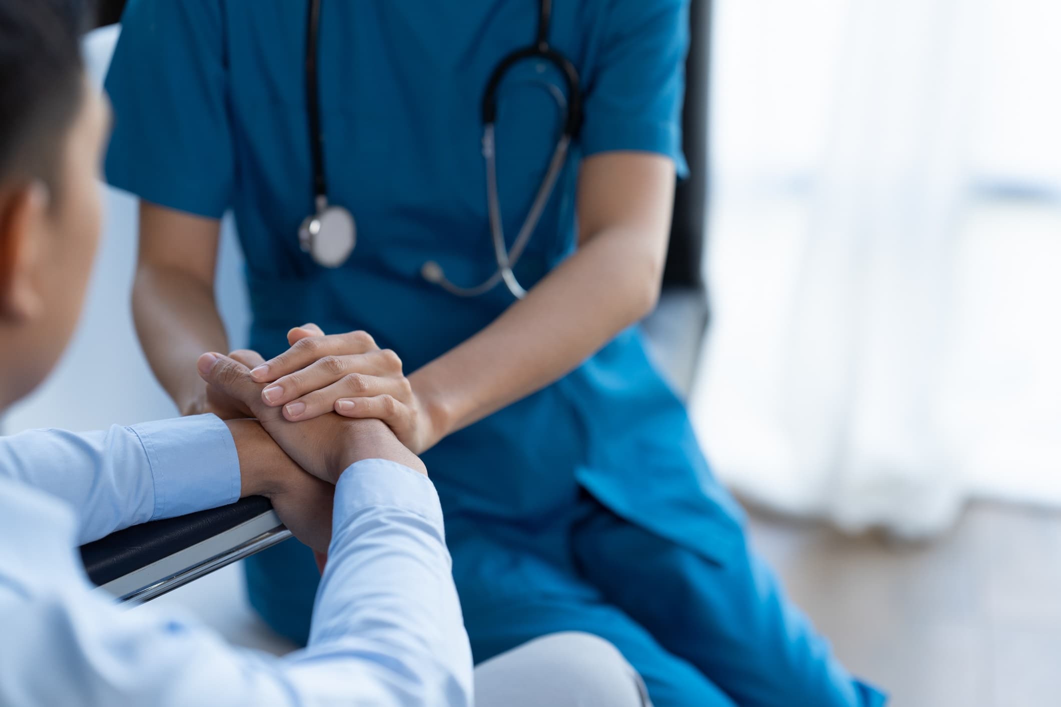 Healthcare professional supporting patient